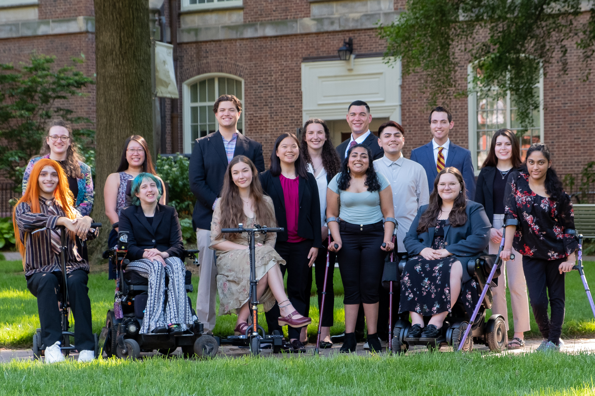 2022 AAPD Interns Group of 13 interns gathered outside looiking at camera some sitting and some standing