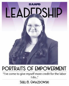 Sueli’s portrait of empowerment graphic has a black and white image of Sueli in front of a purple background with the word “leadership” at the top. Sueli is a white Latinx person with long wavy hair. She is wearing a dark blazer with a floral shirt. Their quote reads “I’ve come to give myself more credit for the labor I do…”