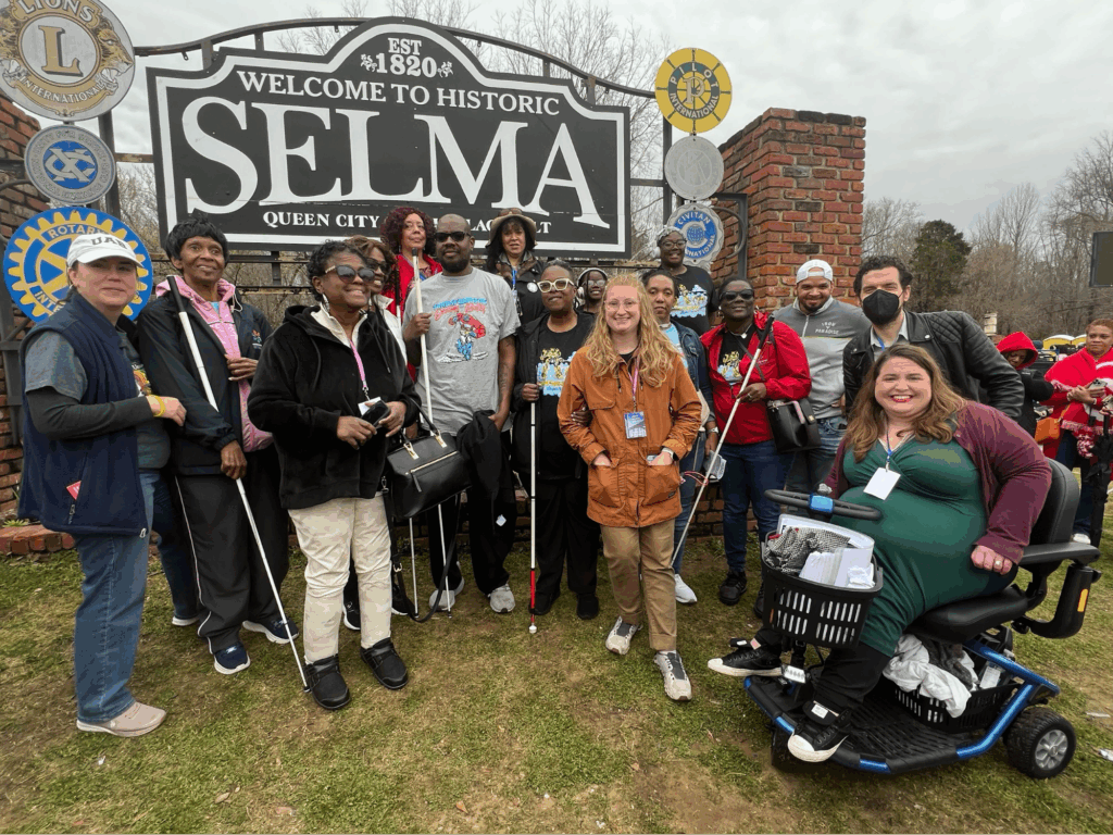 Maria Town posing with AAPD staff and allies in Selma