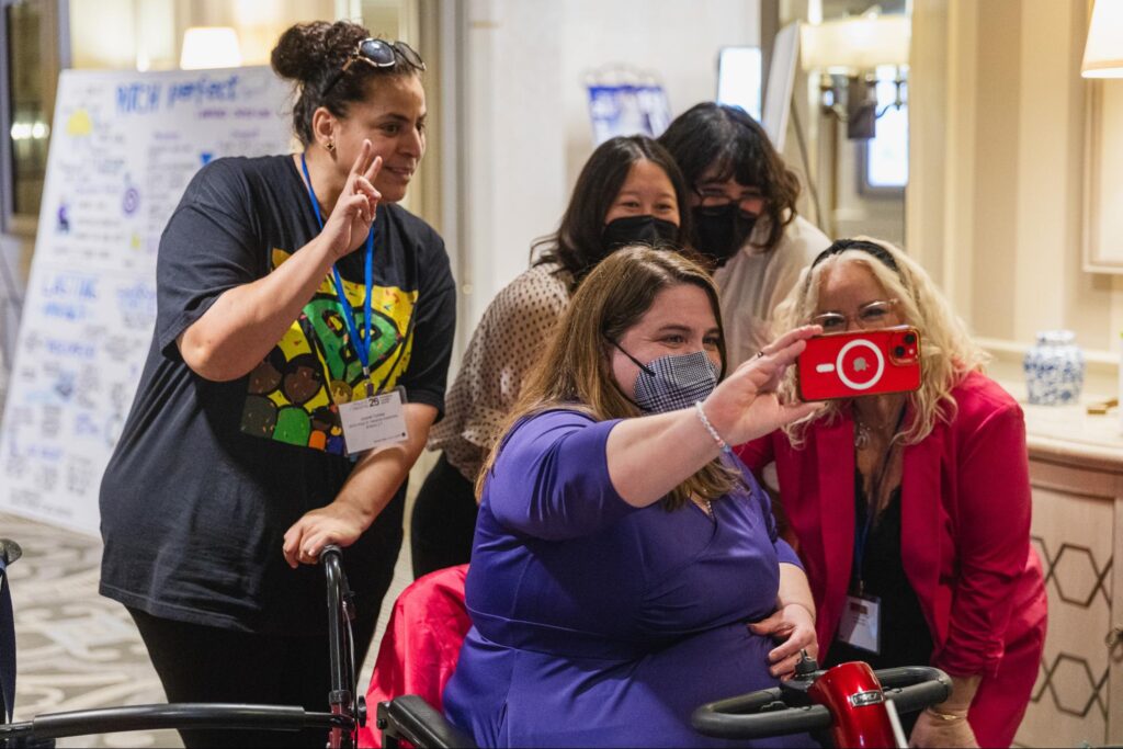 Maria town taking a selfie with colleagues