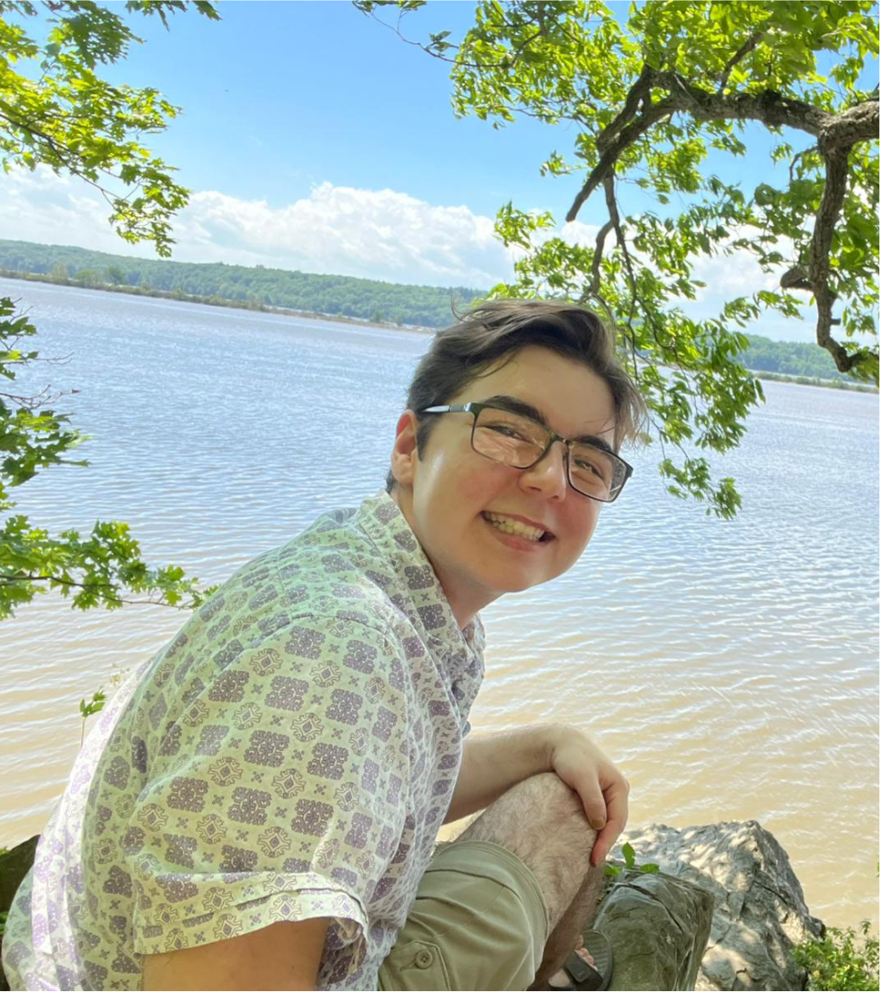 Maddox smiling. The Hudson River is visible in the background.